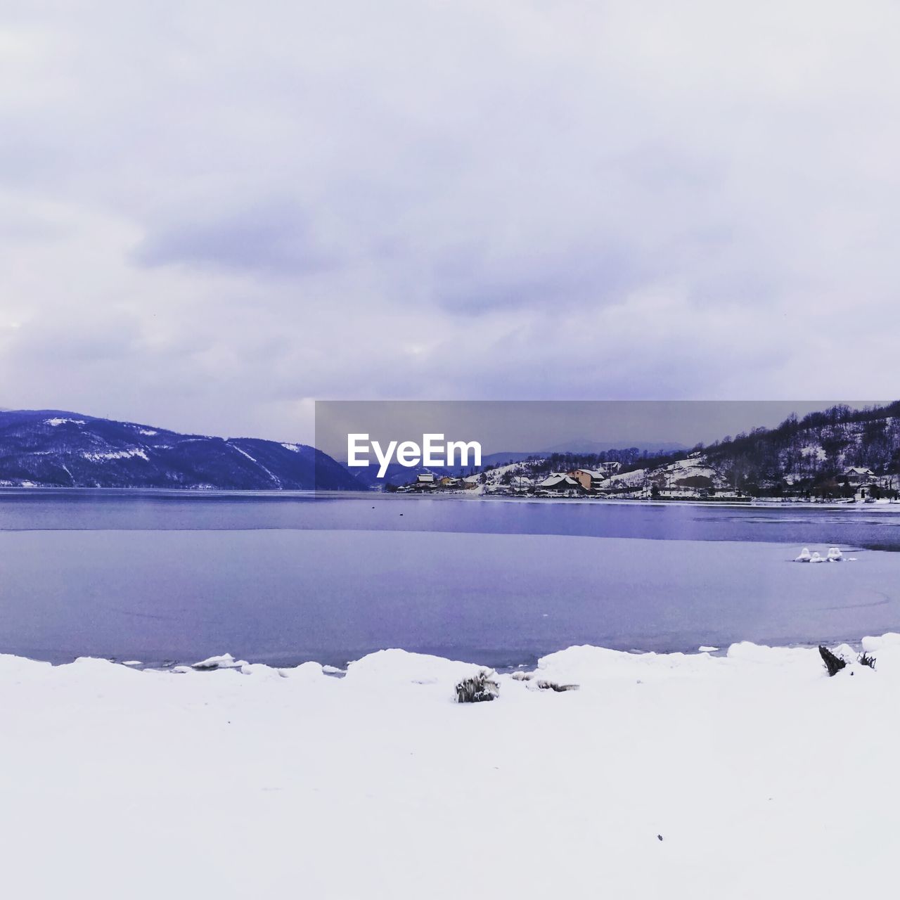 Scenic view of frozen lake against sky