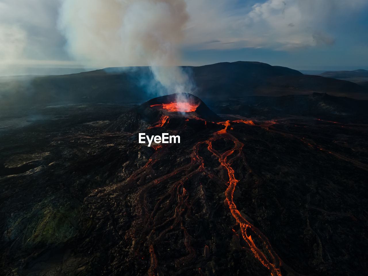 Scenic view of volcano against sky during sunset