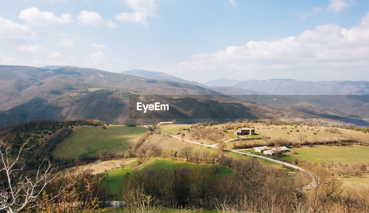 Scenic view of landscape against cloudy sky