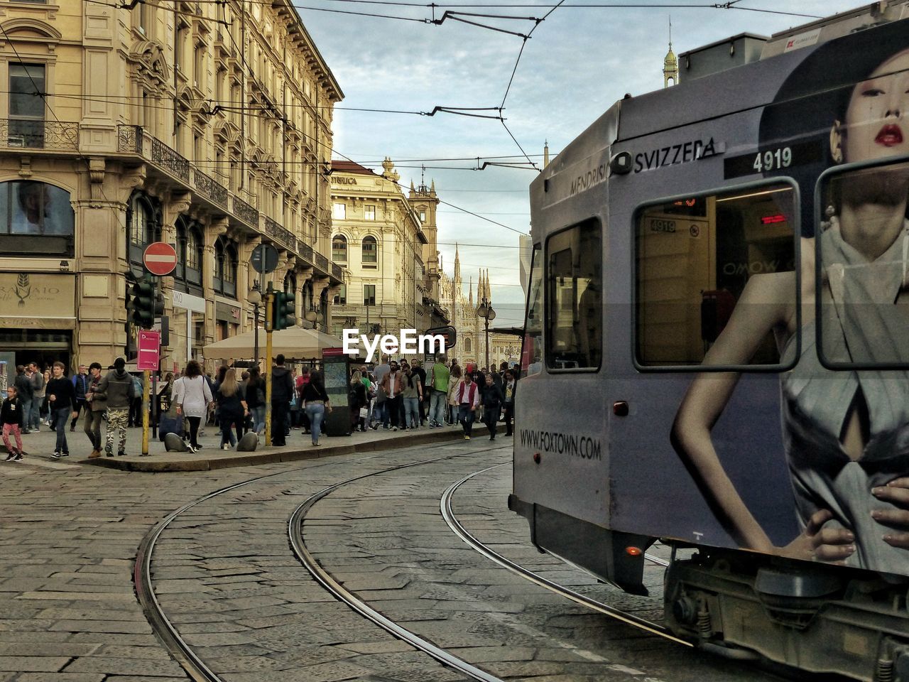 VIEW OF TRAIN ON RAILROAD TRACK IN CITY