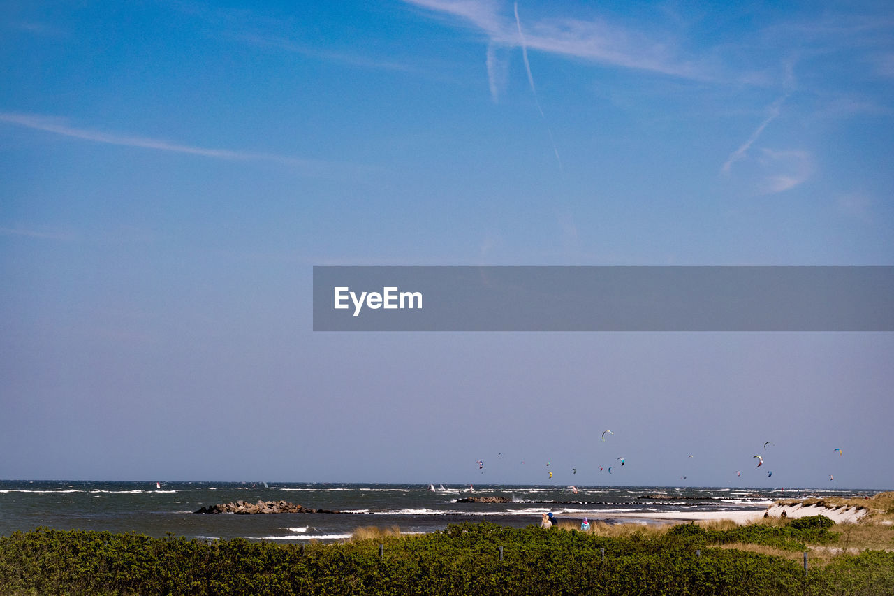 Scenic view of sea against clear blue sky