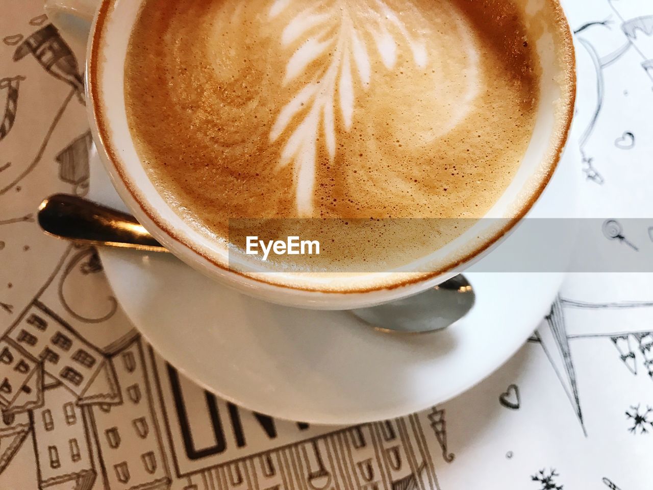 High angle view of cappuccino on table