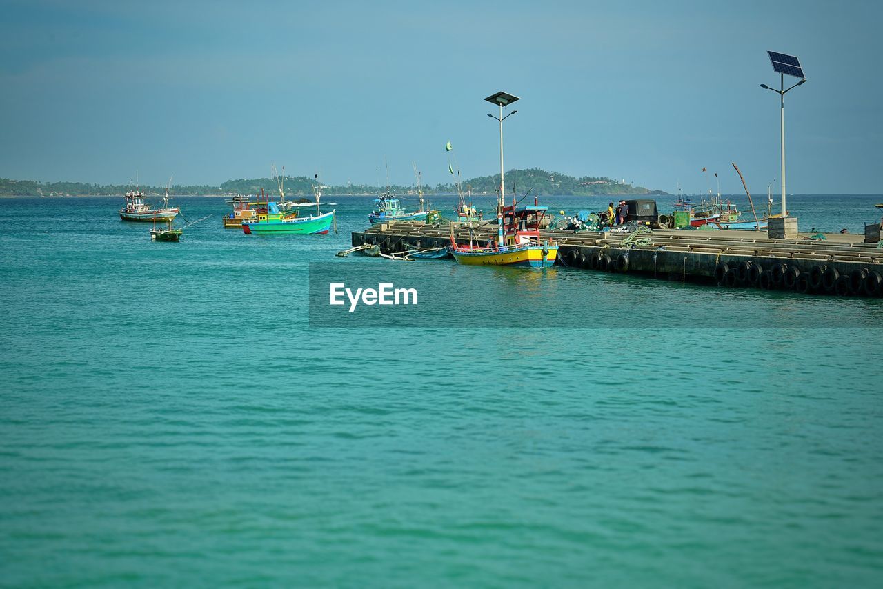 BOATS IN SEA AGAINST CLEAR SKY