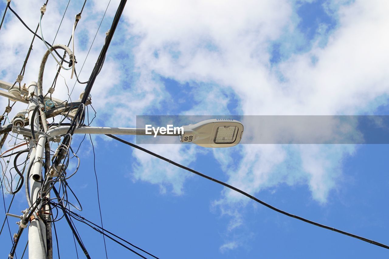 Low angle view of street light against sky