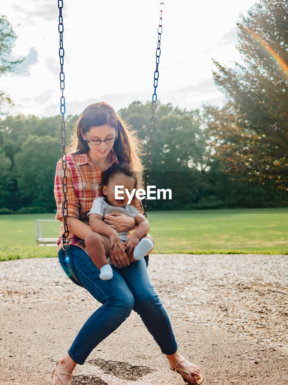 PORTRAIT OF HAPPY GIRL ON PLAYGROUND