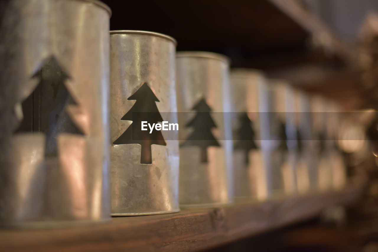 LOW ANGLE VIEW OF CROSS ON WOOD