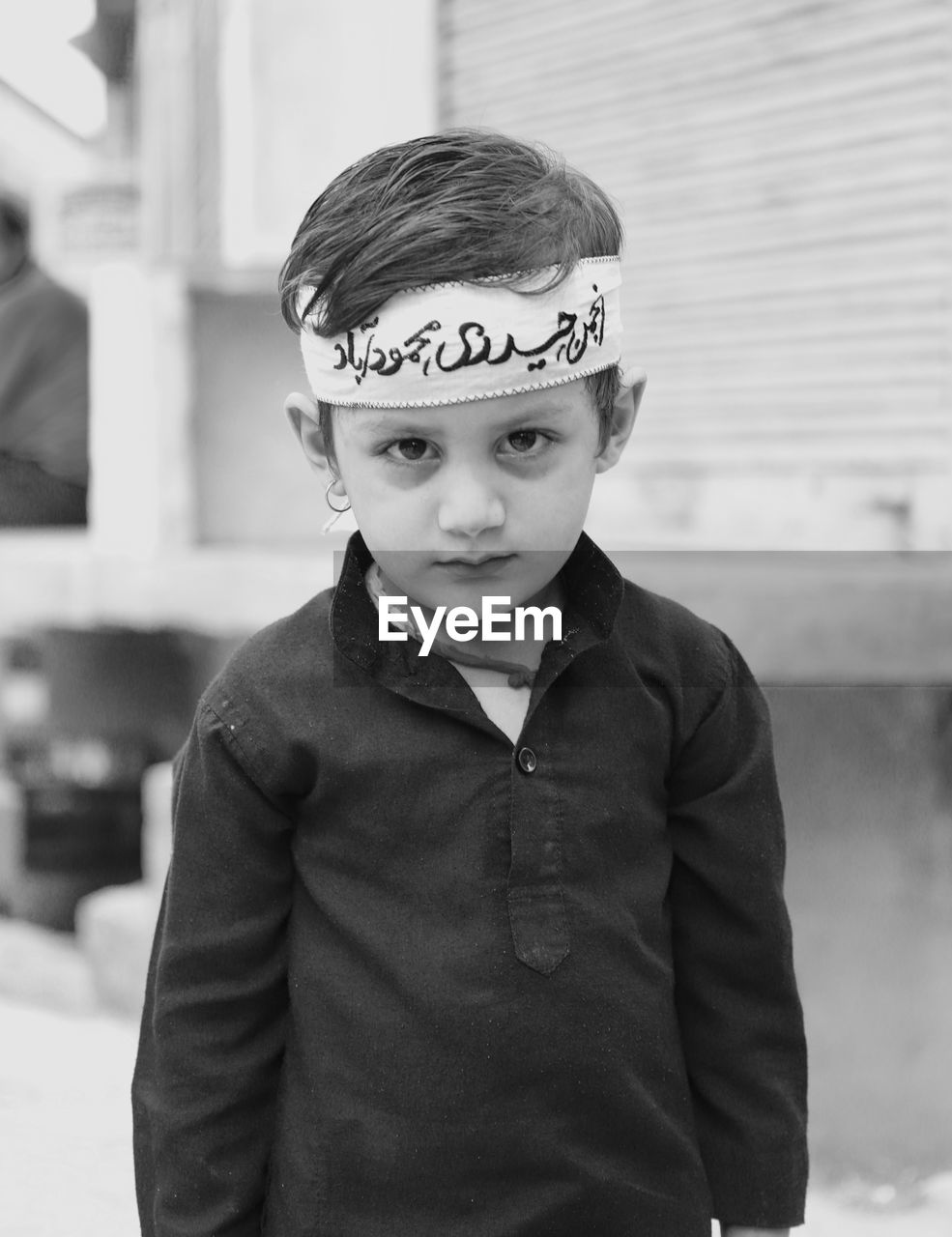 Portrait of boy standing on street