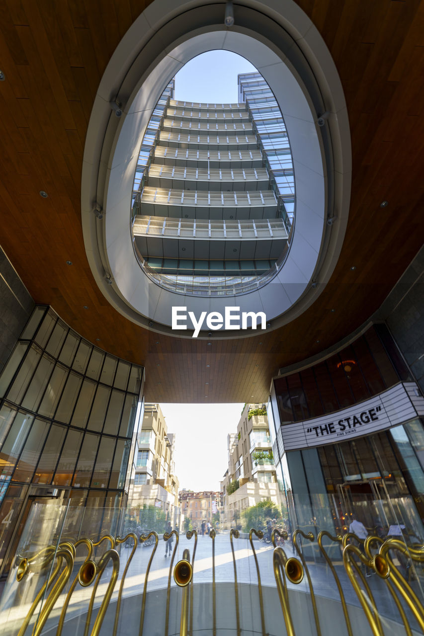 LOW ANGLE VIEW OF BUILDING SEEN THROUGH SKYLIGHT