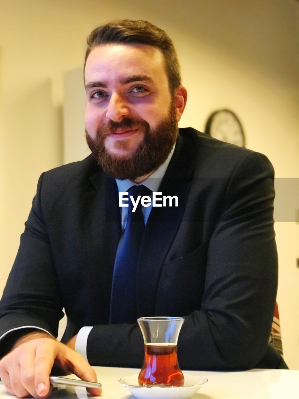 Portrait of mid adult businessman sitting at restaurant