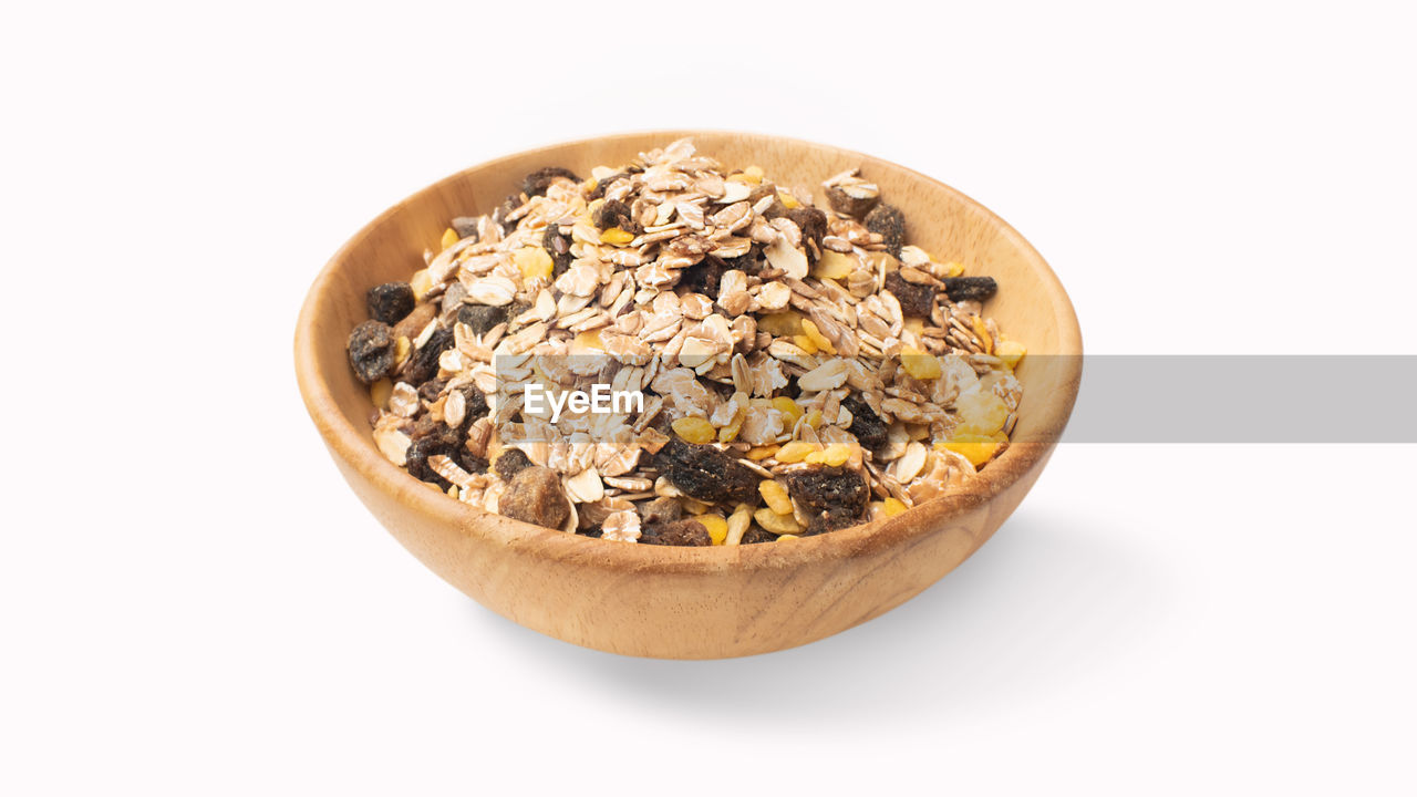 food and drink, food, healthy eating, wellbeing, white background, muesli, cut out, breakfast, studio shot, seed, fruit, bowl, snack, produce, granola, indoors, breakfast cereal, oats - food, no people, meal, vegetarian food, dried food, dish, nut - food, dried fruit, freshness, nut, plant