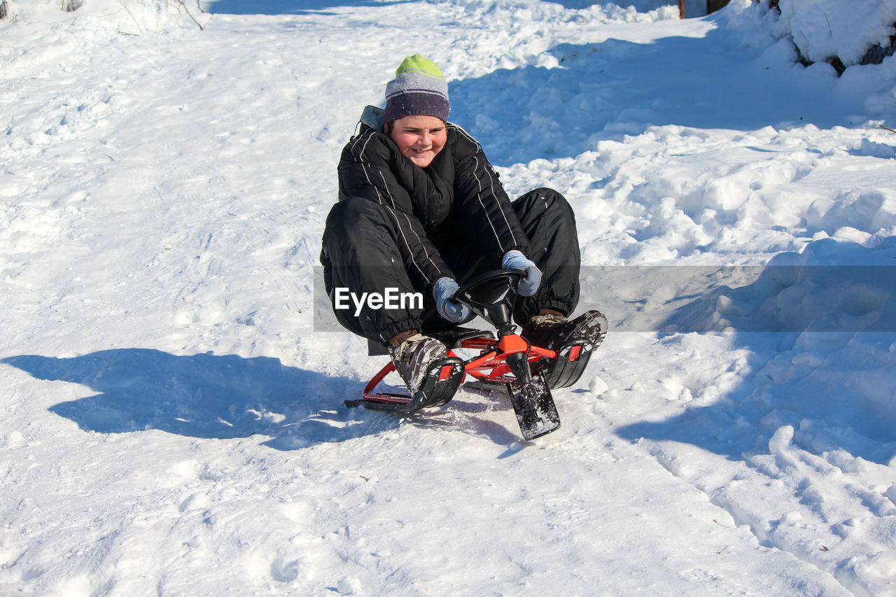 Man in snow on field during winter