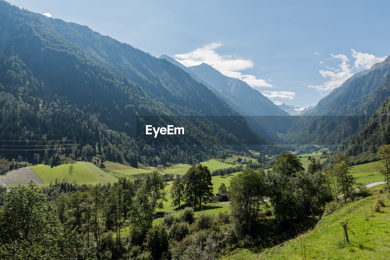 Scenic view of landscape and mountains against sky