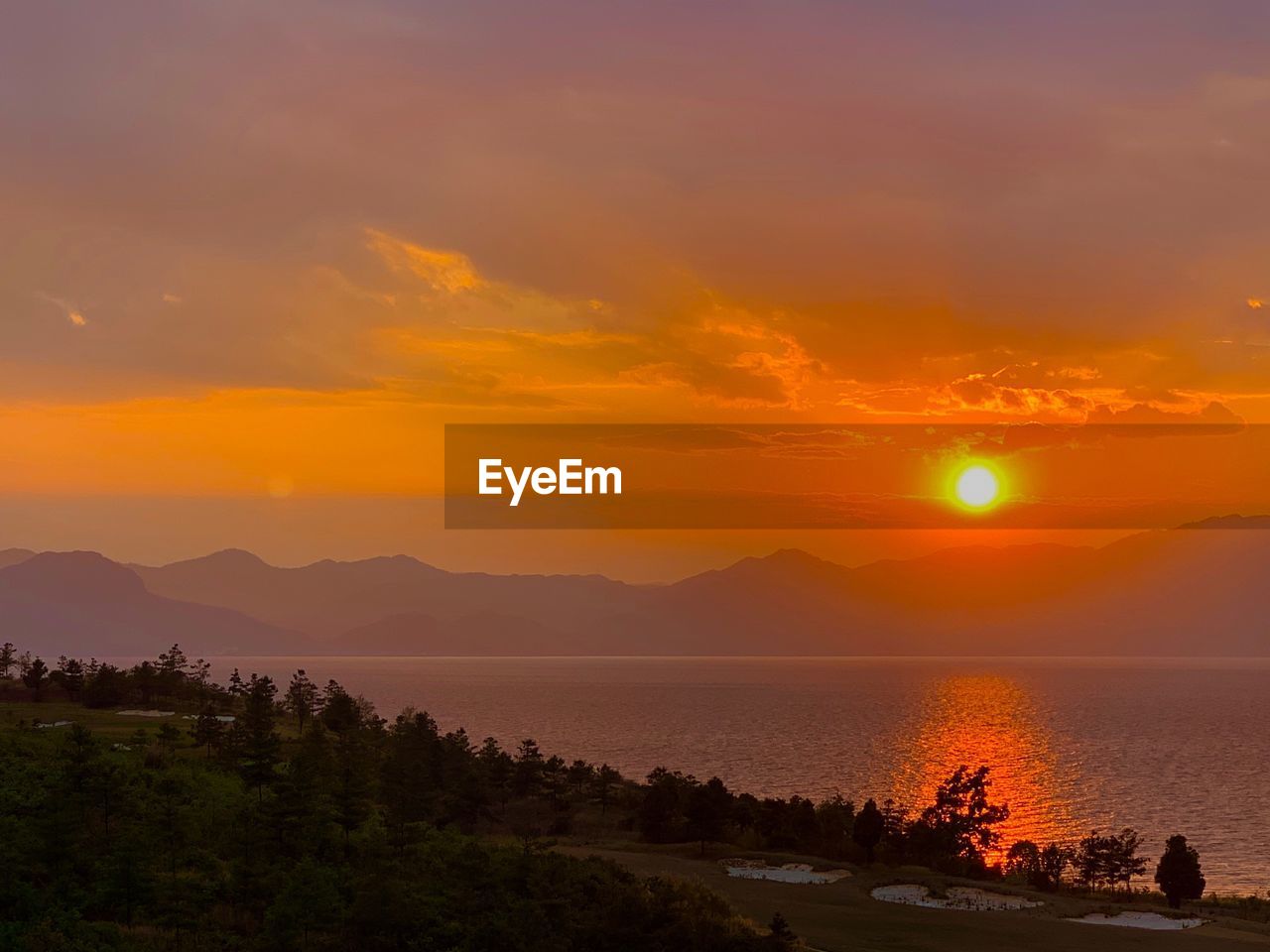 Scenic view of sea against sky during sunset