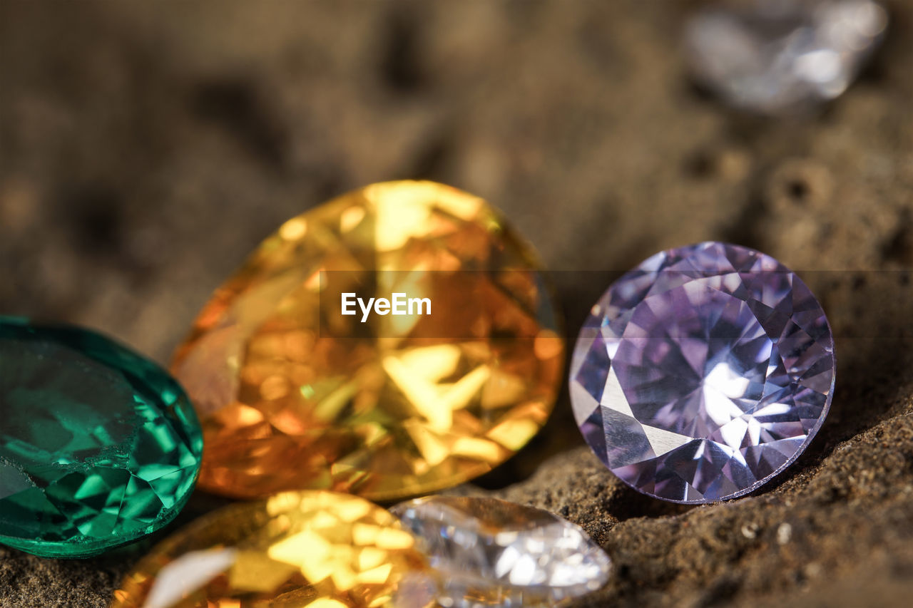 gemstone, jewellery, jewelry, wealth, shiny, yellow, luxury, precious gem, fashion accessory, diamond, crystal, no people, close-up, ruby, sapphire, rock, stone, indoors, still life, multi colored, nature, studio shot, selective focus, gold, geology, mineral