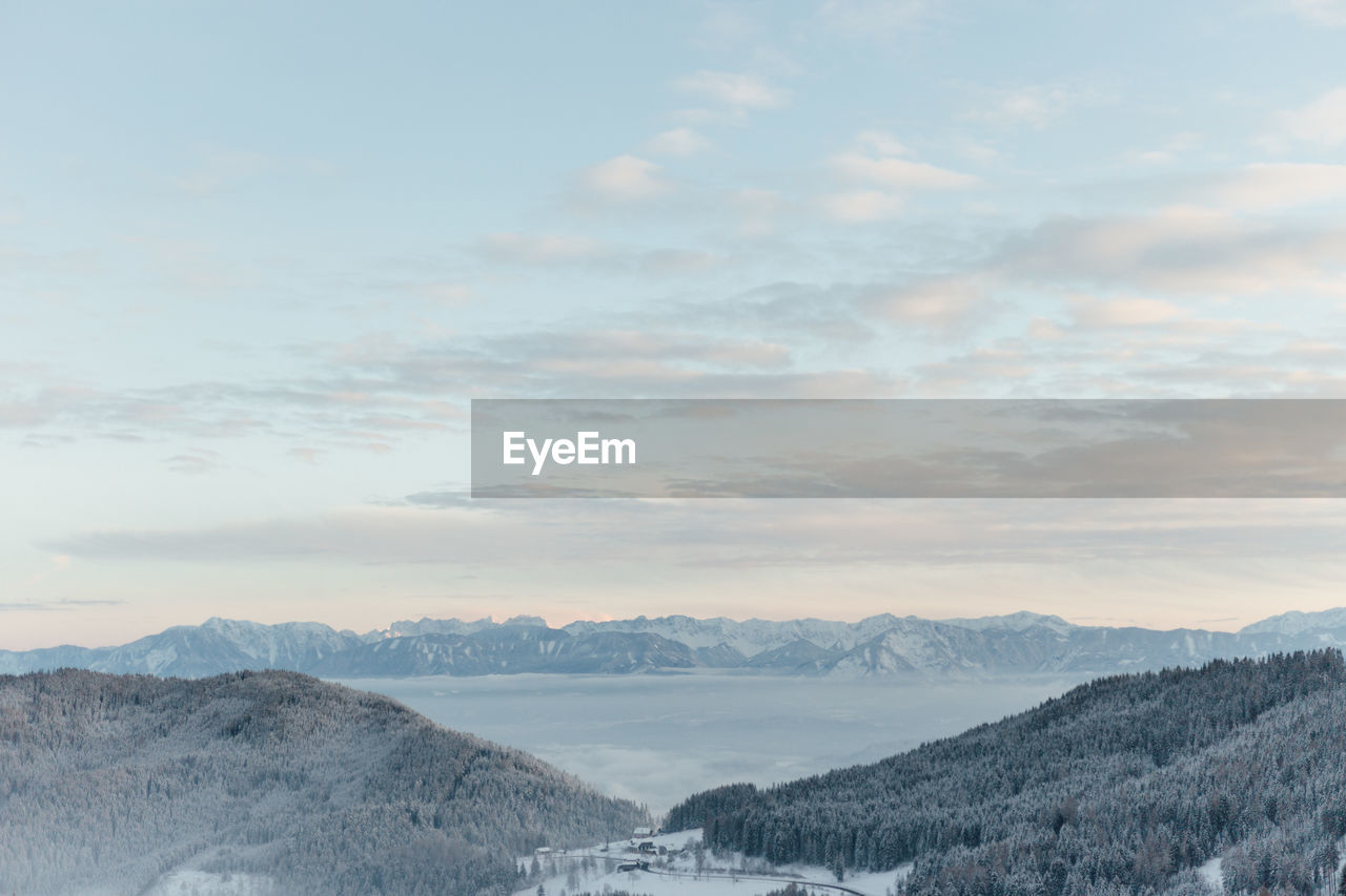 Scenic view of snowcapped mountains against sky