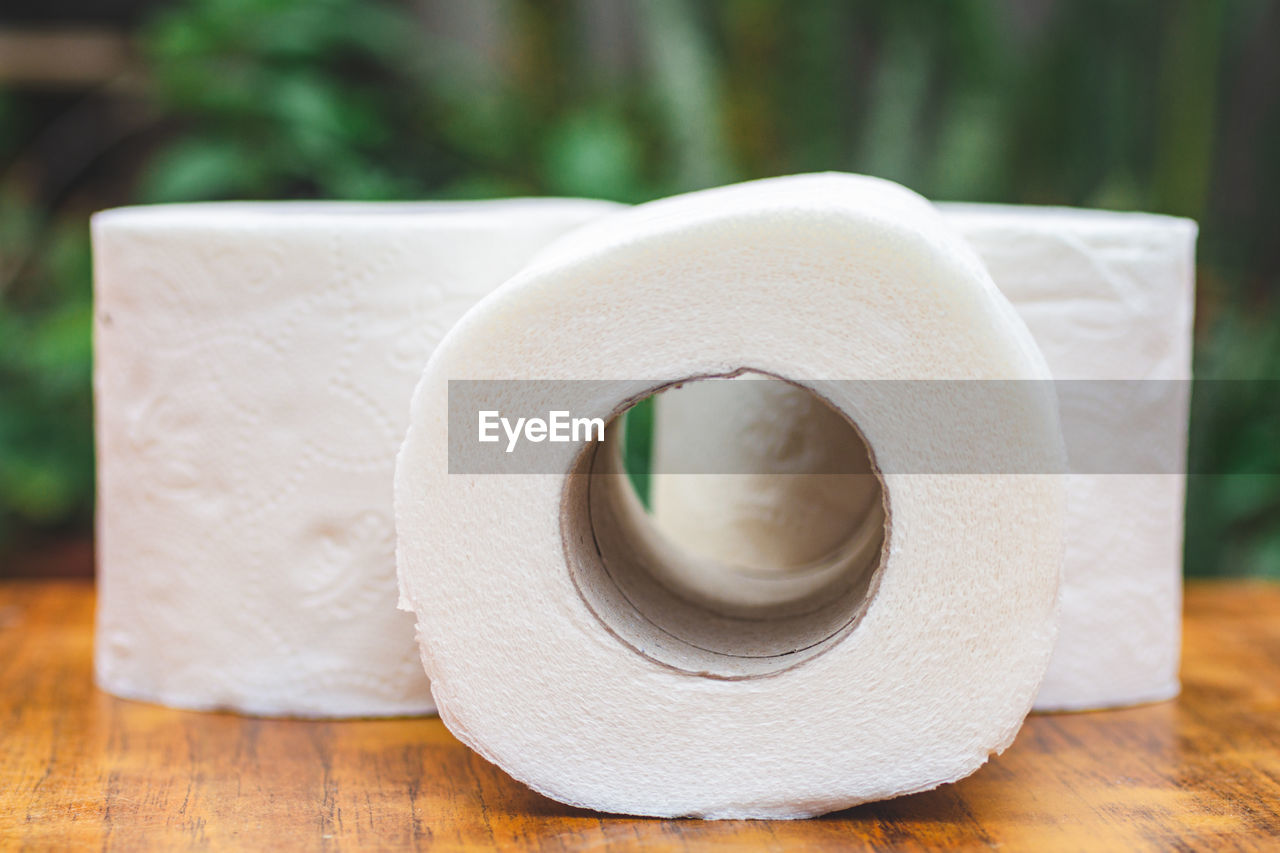 Close-up of white  toilet paper on table