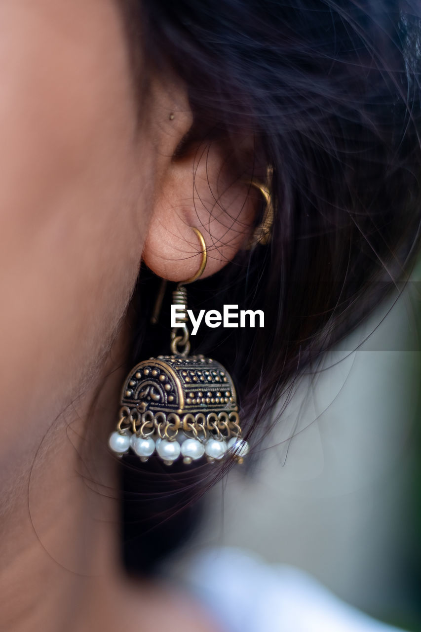 Close-up of woman wearing earrings