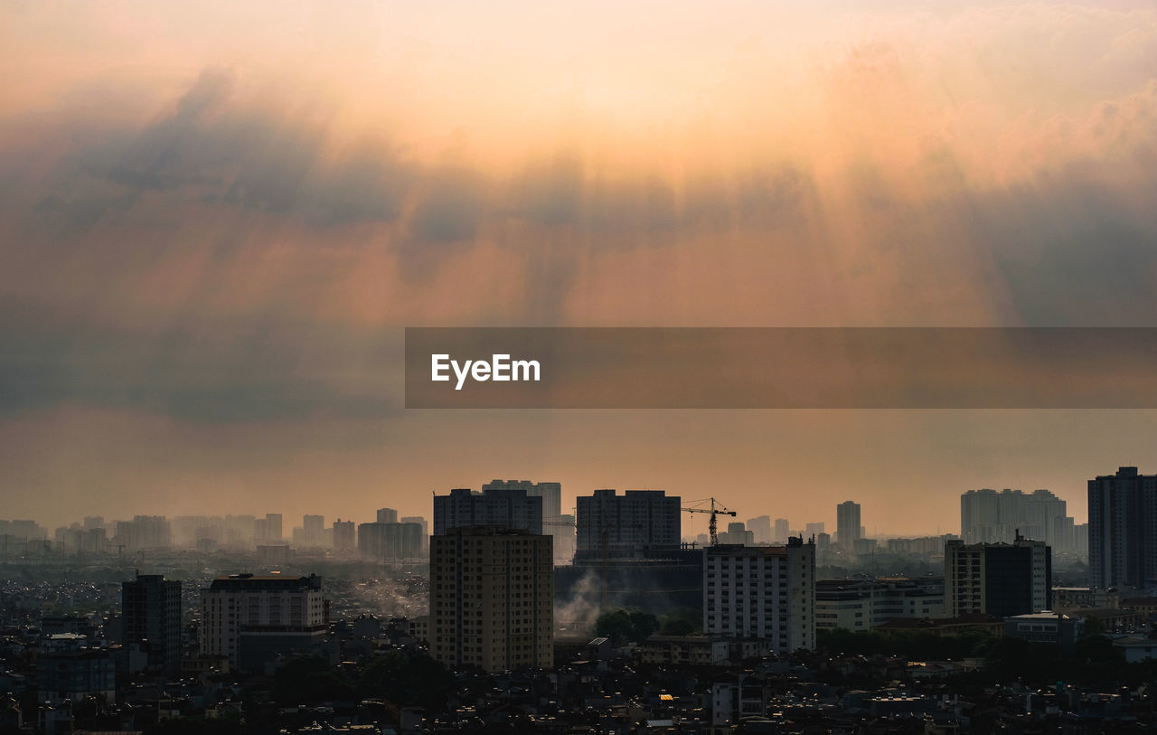 Cityscape against sky during sunset