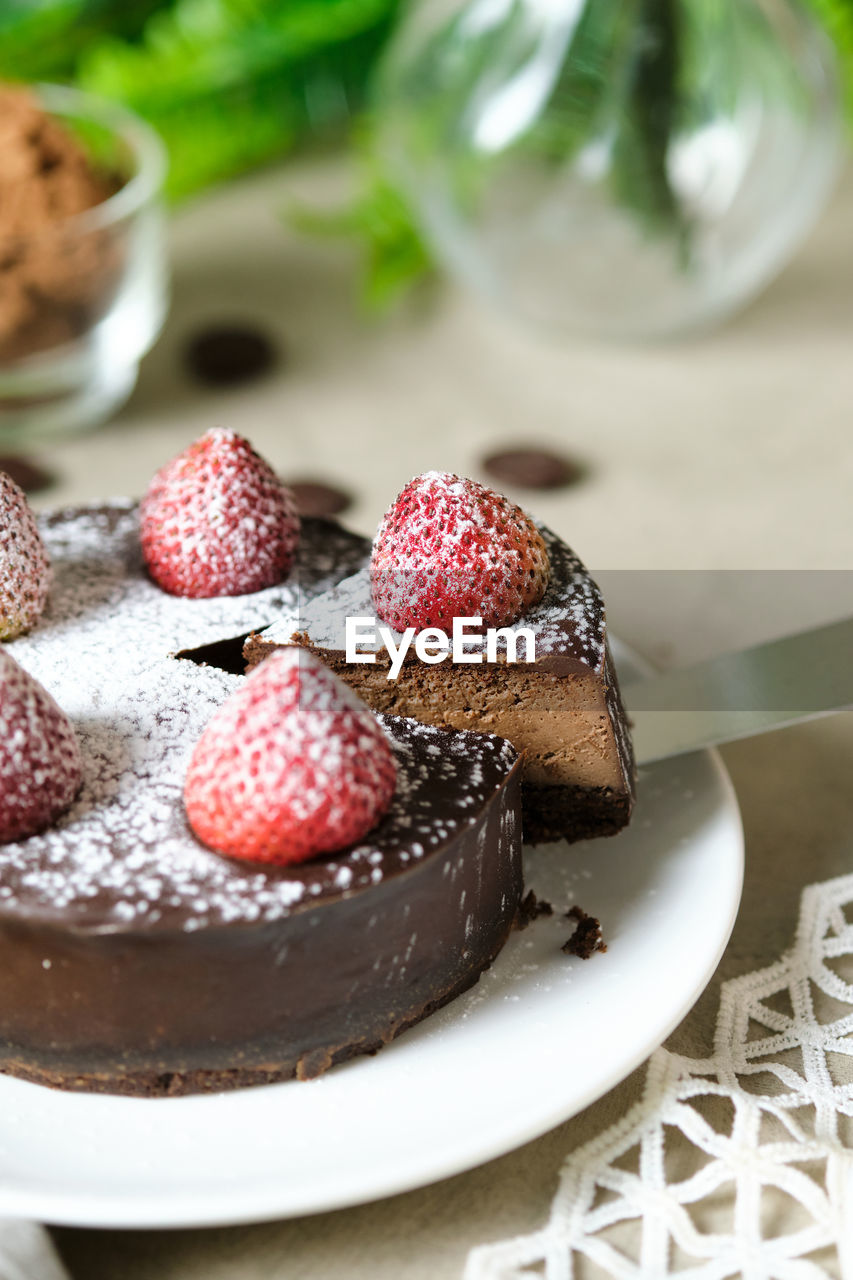 CLOSE-UP OF CAKE WITH STRAWBERRIES