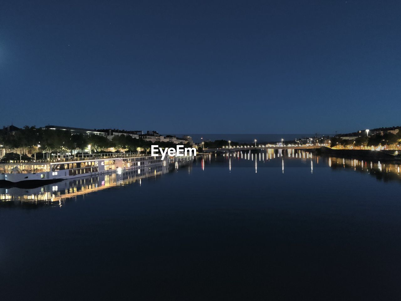 water, reflection, night, dusk, sky, horizon, architecture, sea, no people, nature, marina, built structure, building exterior, evening, illuminated, city, copy space, dock, building, clear sky, travel destinations, cityscape, nautical vessel, scenics - nature, outdoors, beauty in nature, waterfront, transportation, tranquility, blue, light