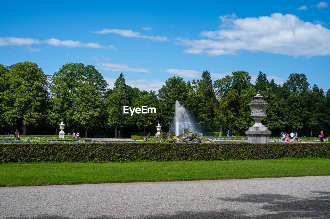 PEOPLE IN PARK AGAINST SKY