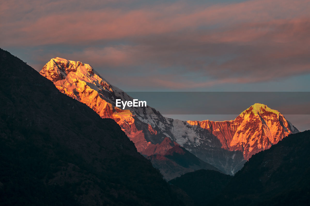 Scenic view of mountain against sky during sunset