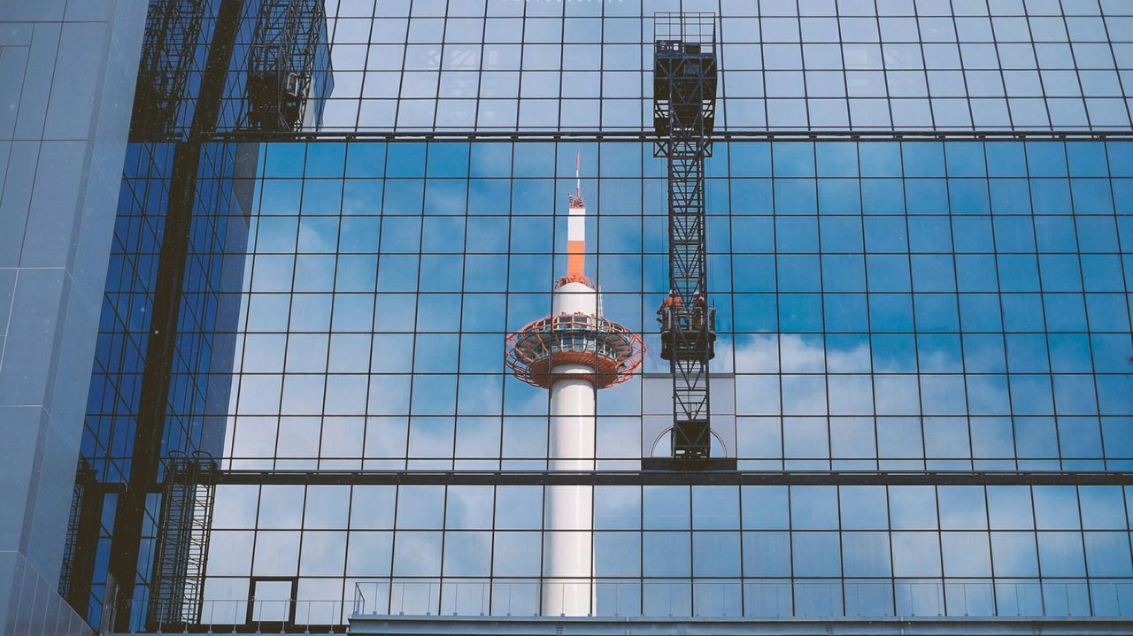 COMMUNICATIONS TOWER AGAINST SKY