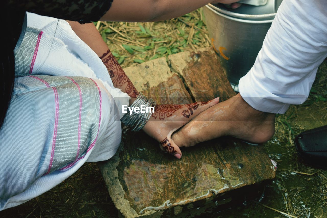 Welcoming bridegroom by washing feet in chakma traditional marriage rituals