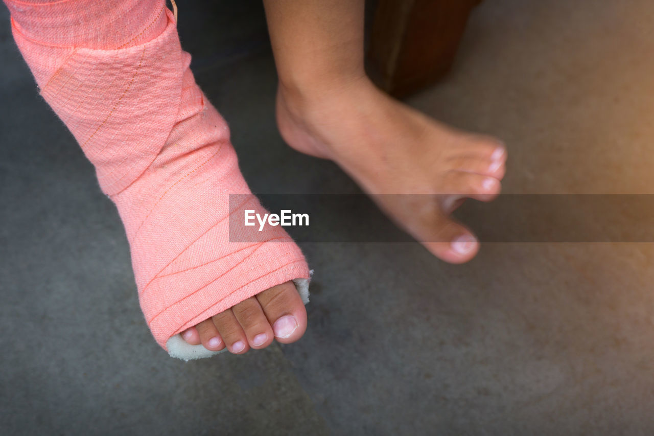 Low section of injured man wrapped with bandage