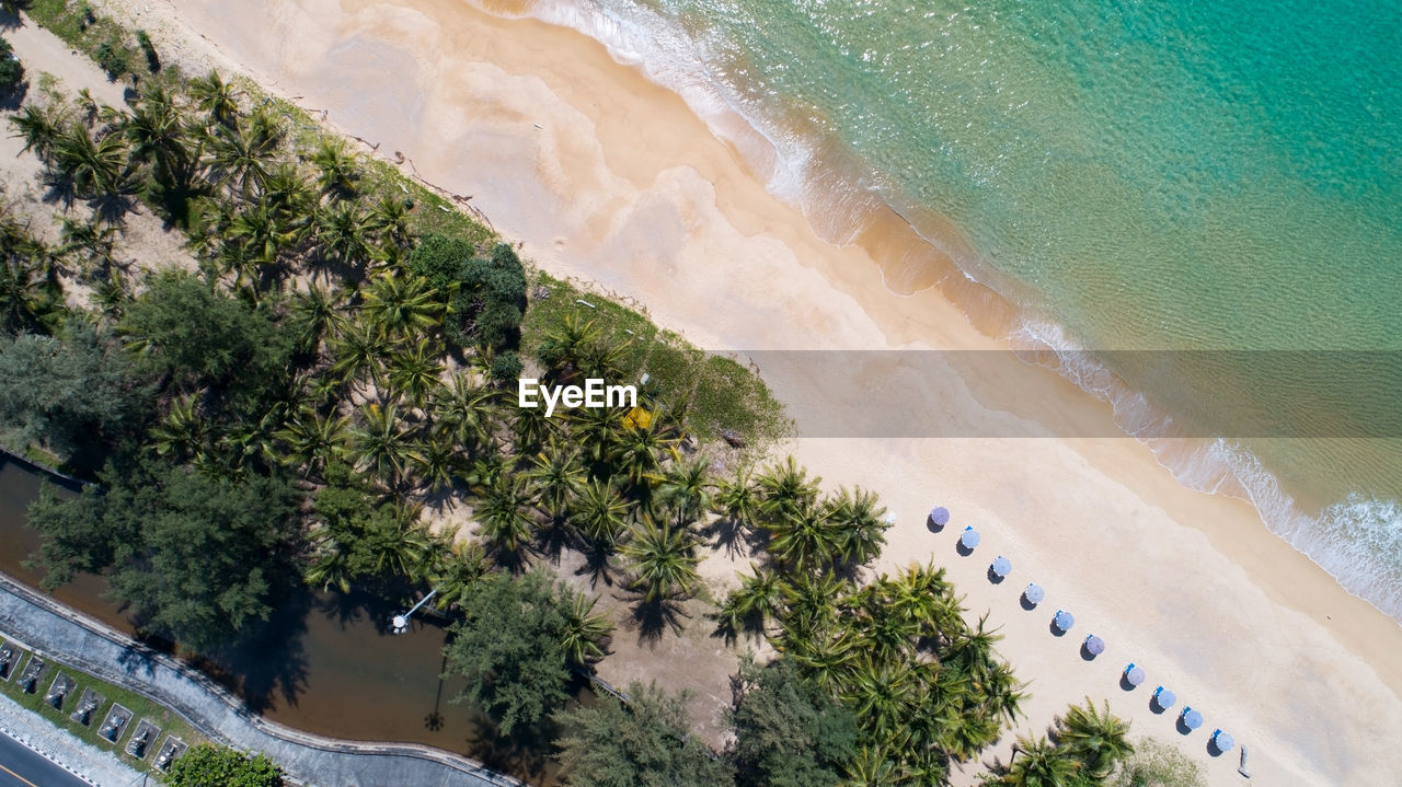 HIGH ANGLE VIEW OF BEACH BY SEA