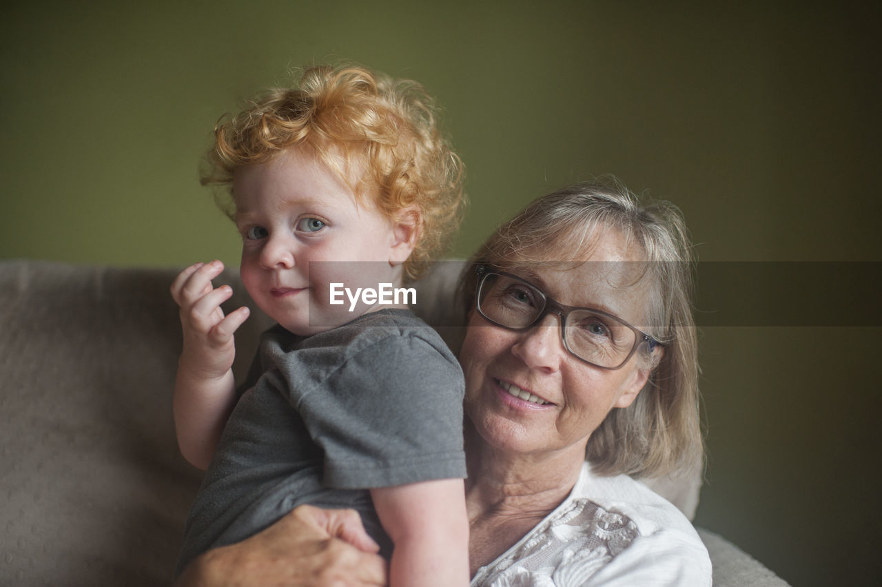 Portrait of grandmother and grandson at home