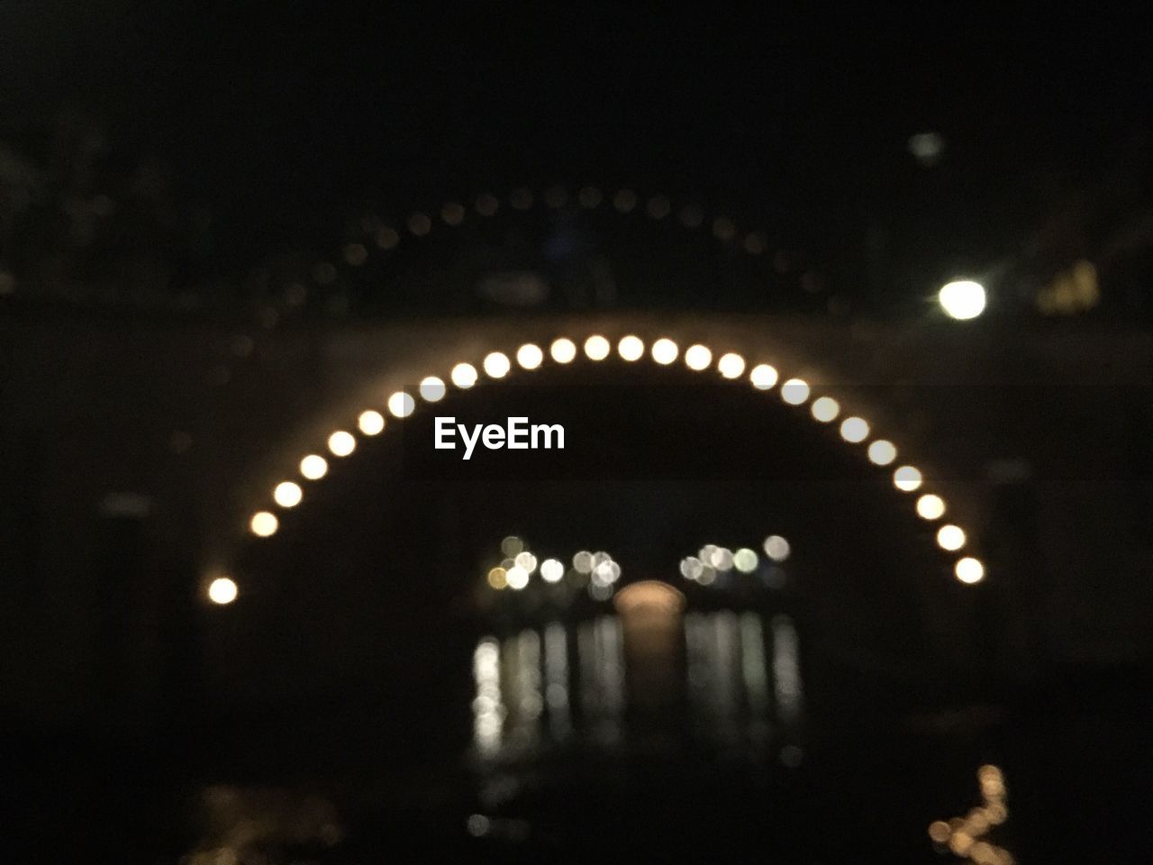 LOW ANGLE VIEW OF TUNNEL AT NIGHT