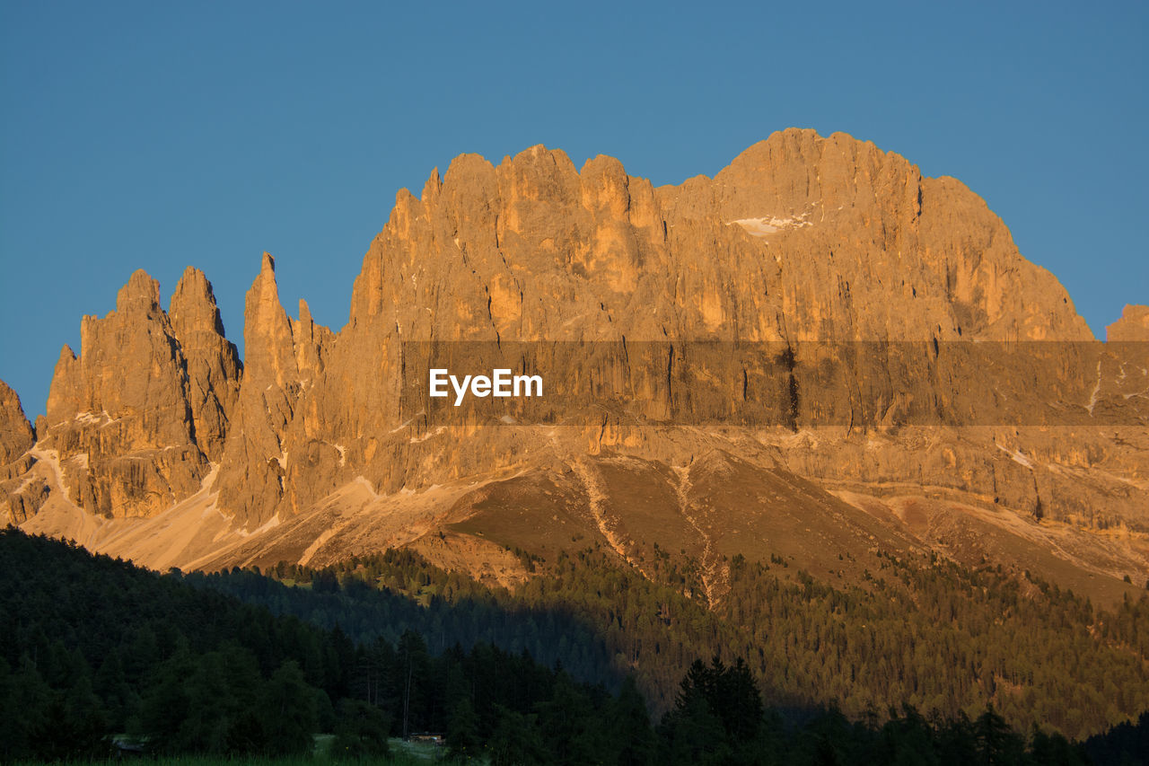 Scenic view of mountains against clear sky