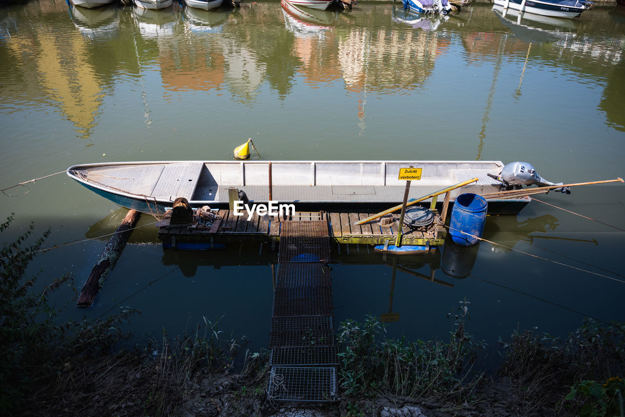 water, nautical vessel, vehicle, reflection, transportation, boat, mode of transportation, lake, moored, boating, nature, watercraft, day, dock, no people, outdoors, fishing, high angle view, tranquility, canoe