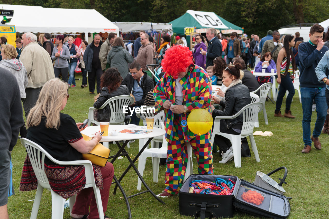 GROUP OF PEOPLE IN THE BACKGROUND