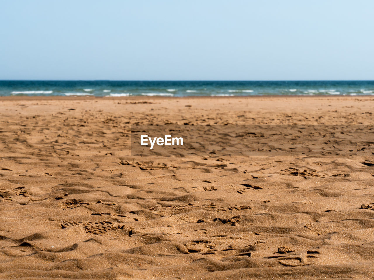 VIEW OF BEACH AGAINST CLEAR SKY