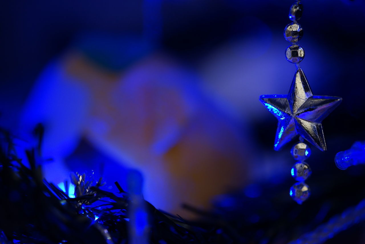 Close-up of christmas decorations at night