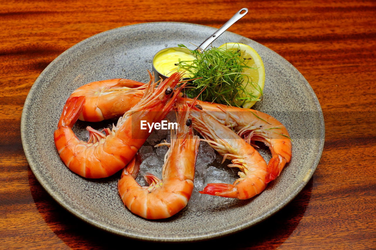 Close-up of prawns in plate on table