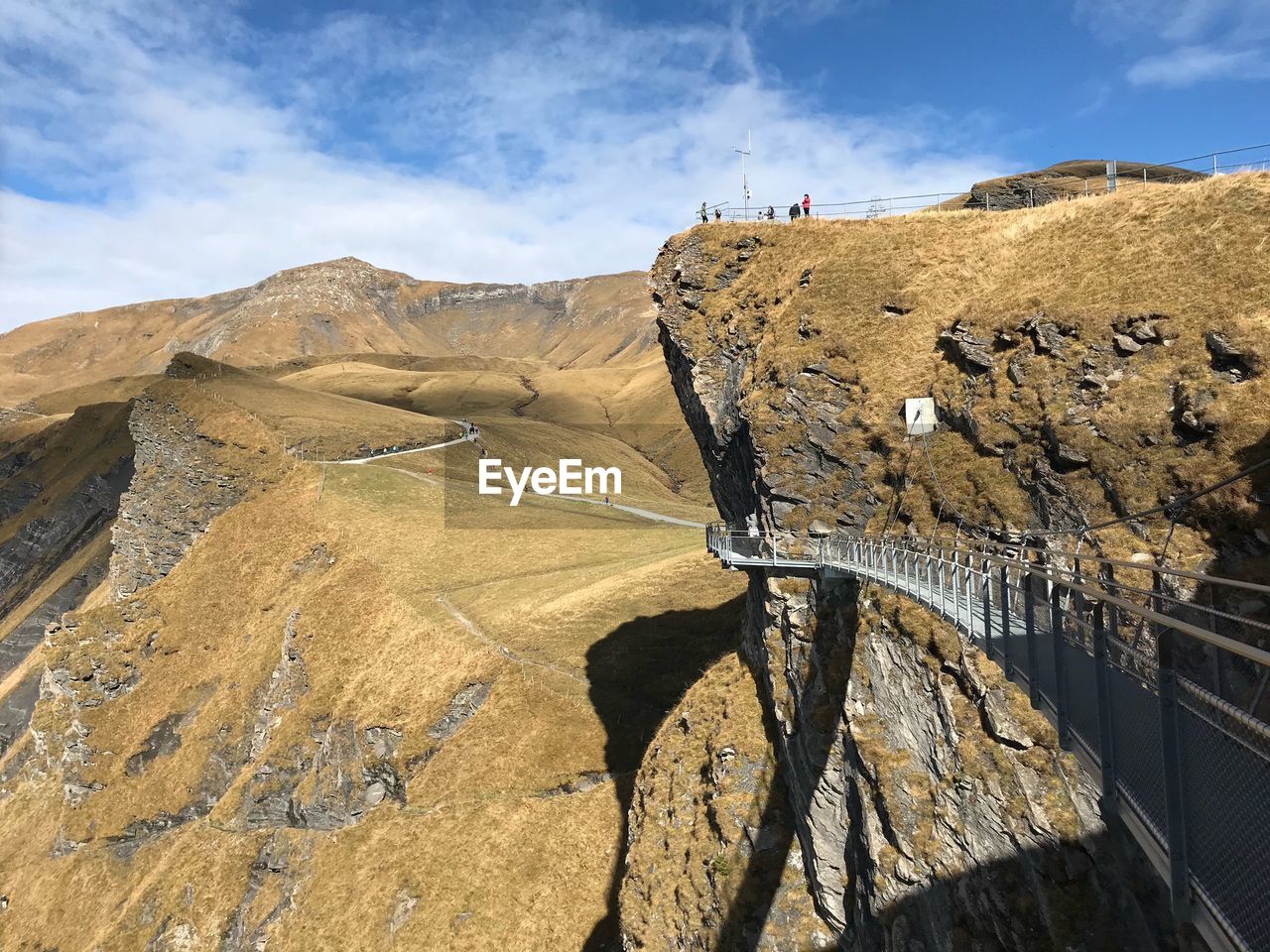 PANORAMIC VIEW OF HORSE ON MOUNTAIN AGAINST SKY