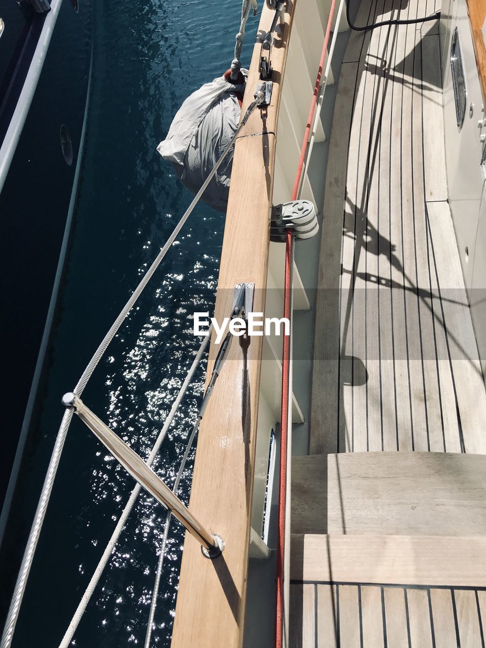 HIGH ANGLE VIEW OF MAN STANDING BY RAILING