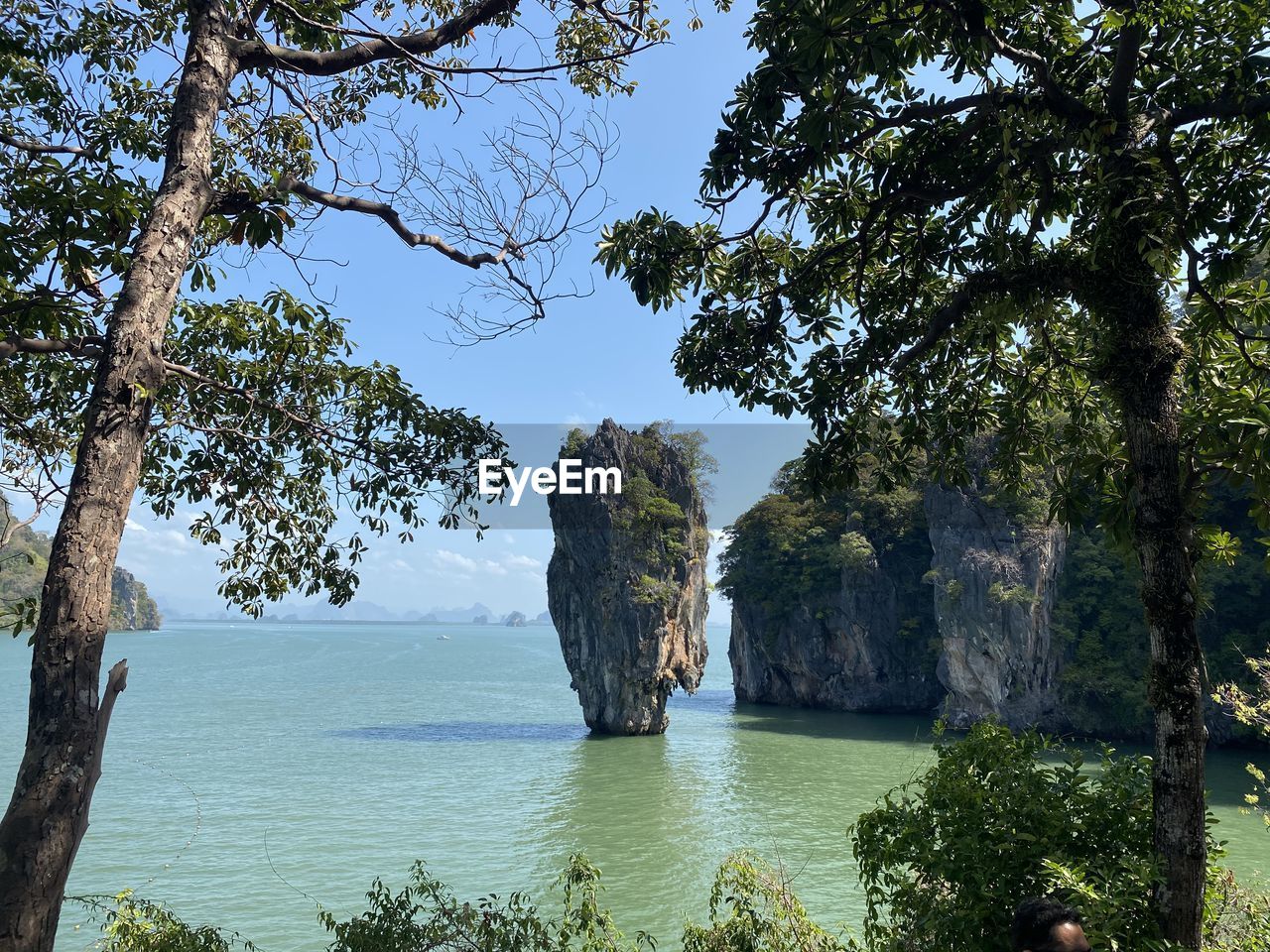 SCENIC VIEW OF SEA AGAINST ROCK FORMATION