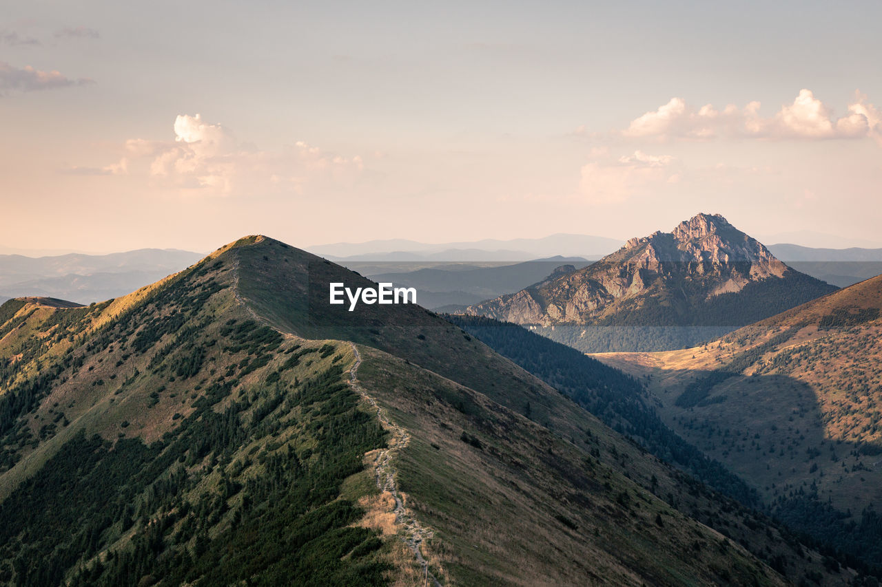 Scenic view of mountains against sky during sunset