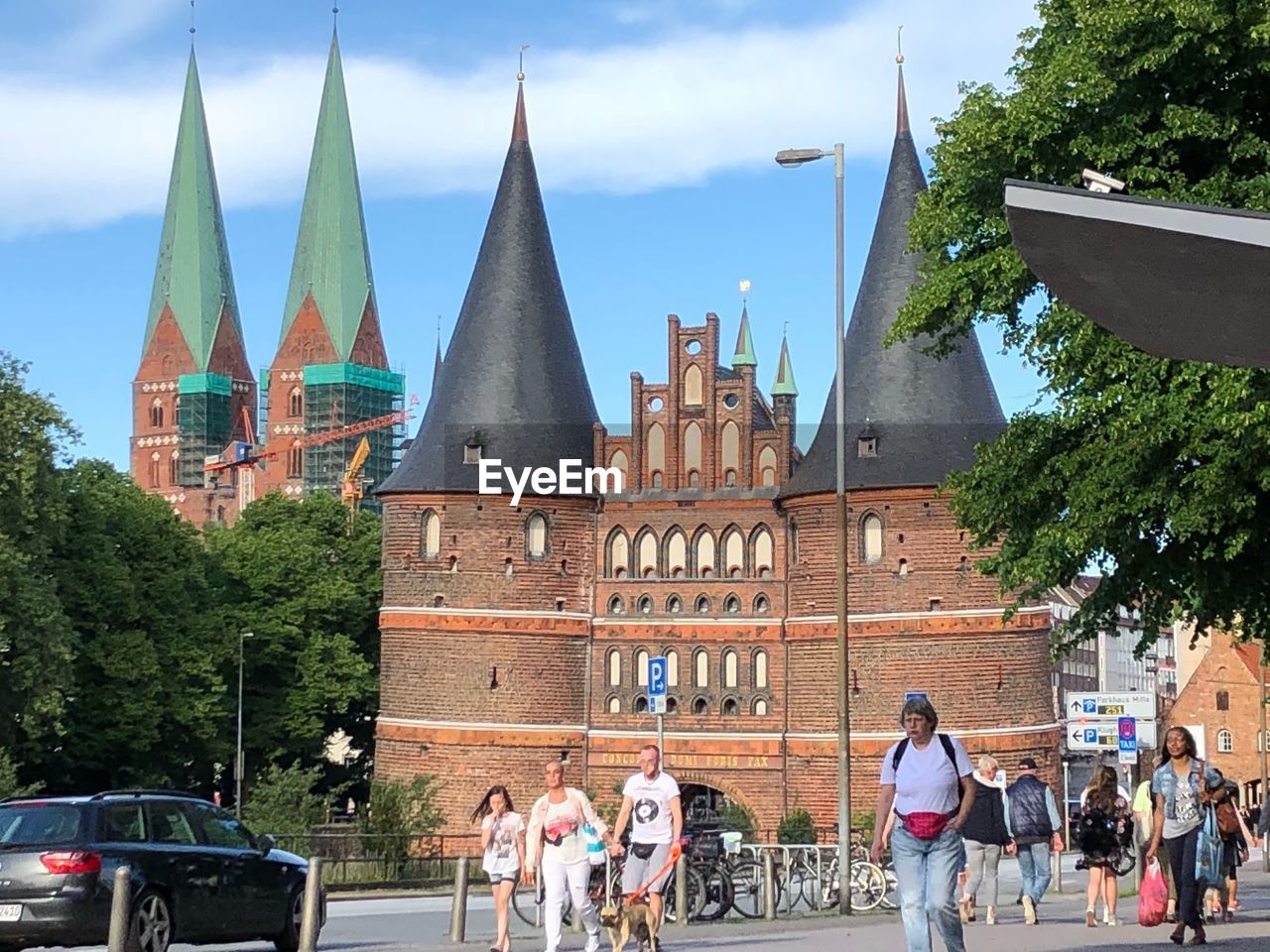 GROUP OF PEOPLE IN FRONT OF BUILDING