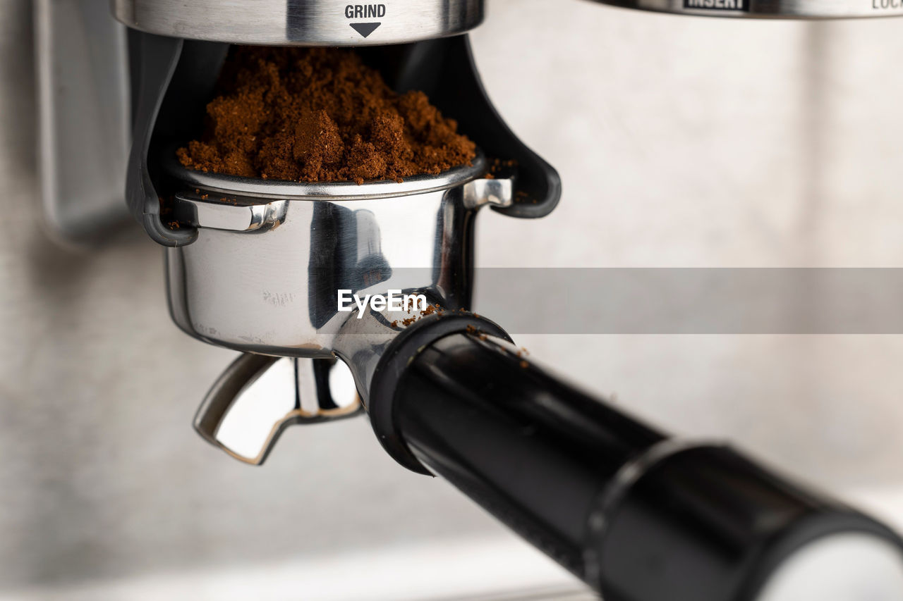 A closeup shot of an espresso coffee machine