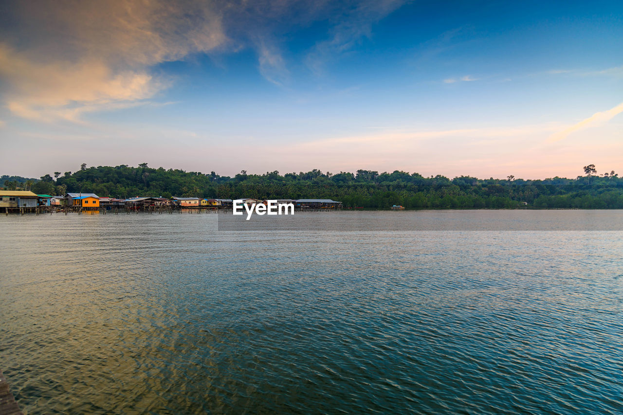 SCENIC VIEW OF RIVER BY TREES AGAINST SKY