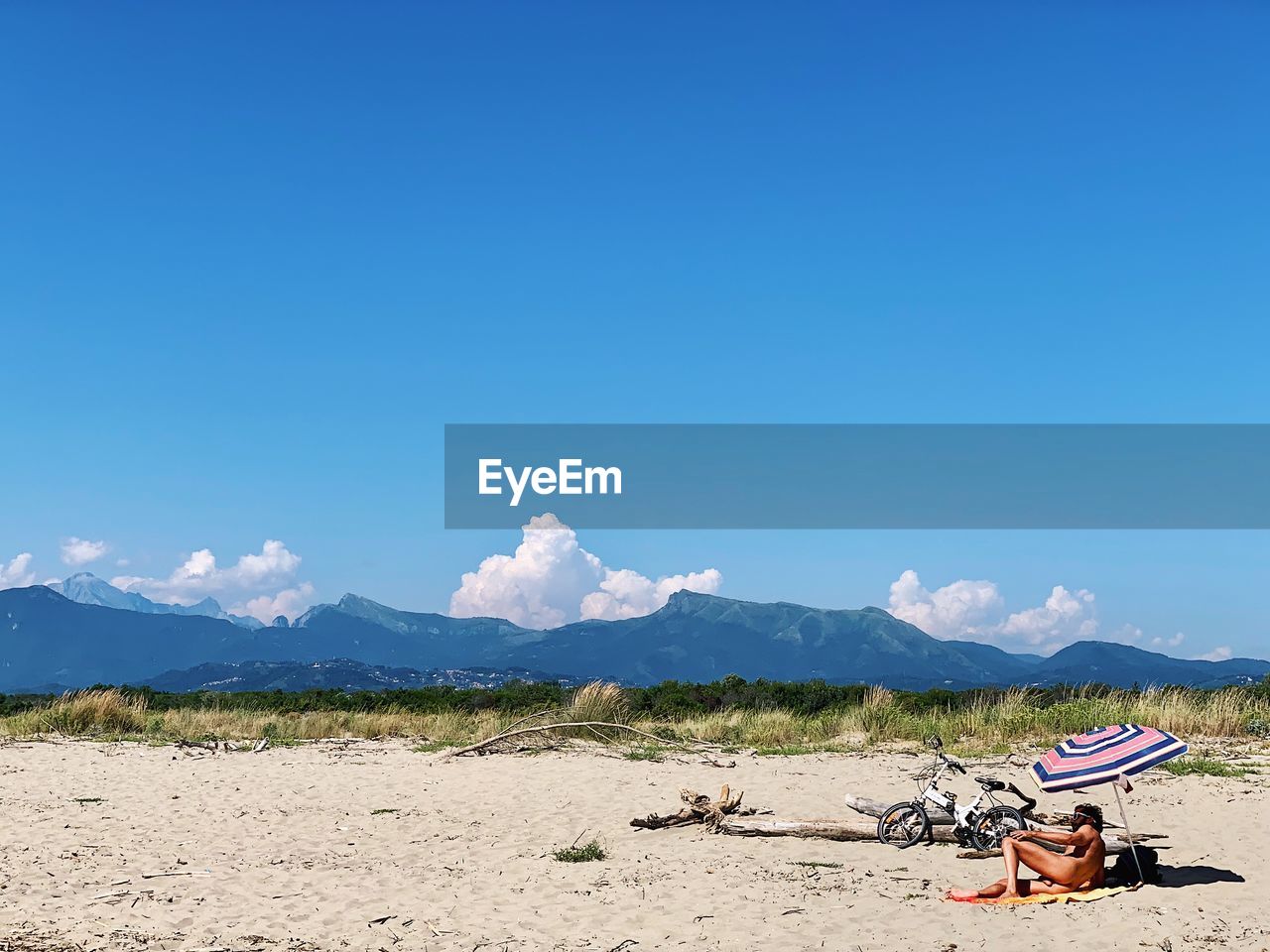 SCENIC VIEW OF MOUNTAINS AGAINST BLUE SKY