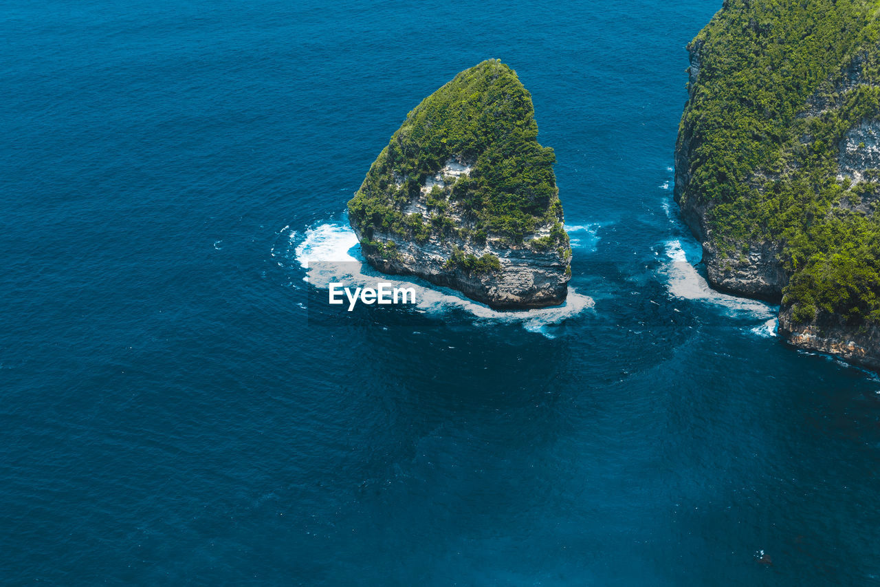 High angle view of rock in sea