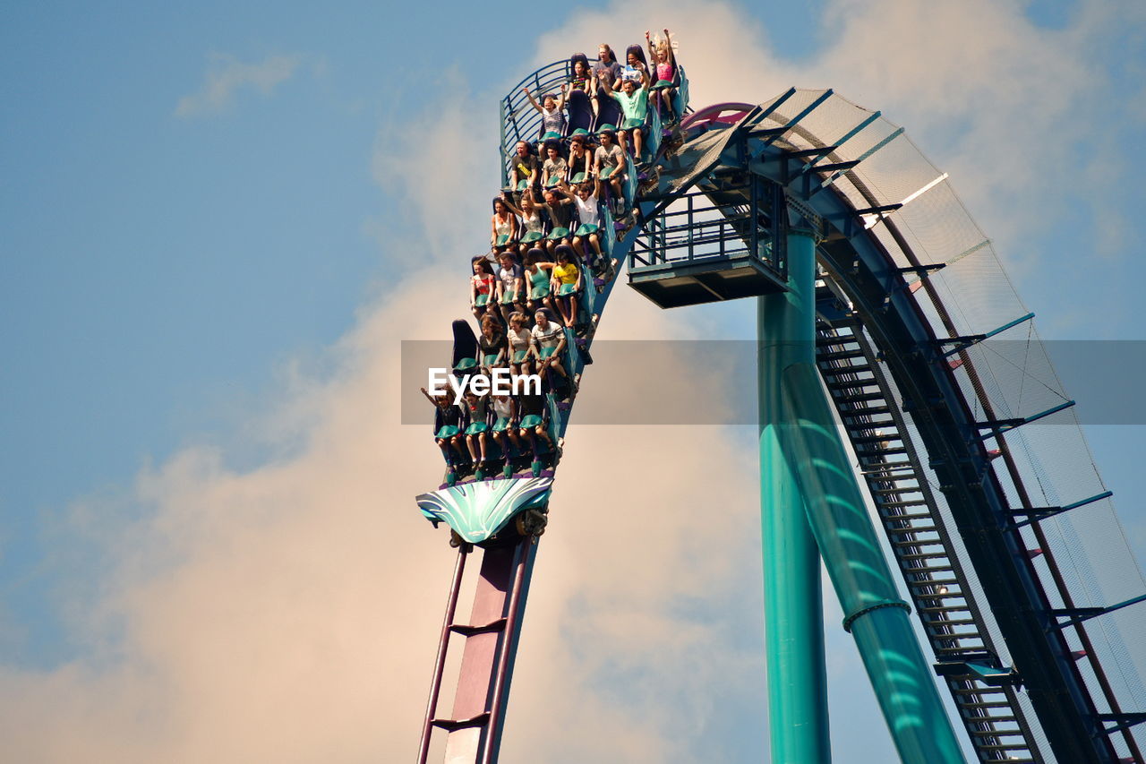 LOW ANGLE VIEW OF ROLLERCOASTER AGAINST SKY