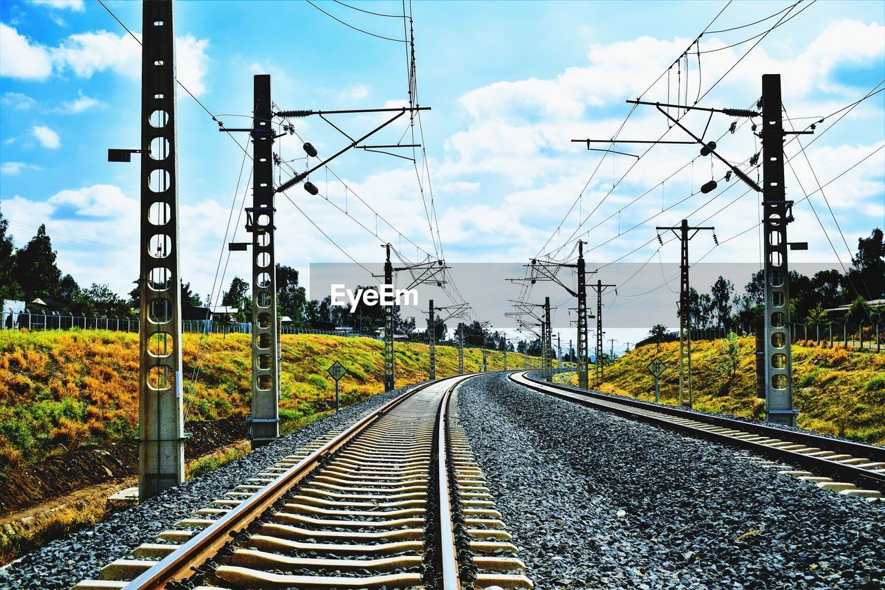 Surface level of railroad tracks against sky