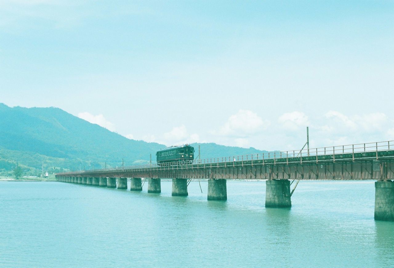 BRIDGE OVER RIVER WITH BRIDGE IN BACKGROUND